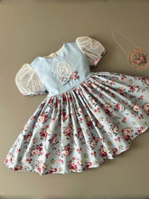 Vintage Floral Ball Gown with Embroidered Blue Bodice